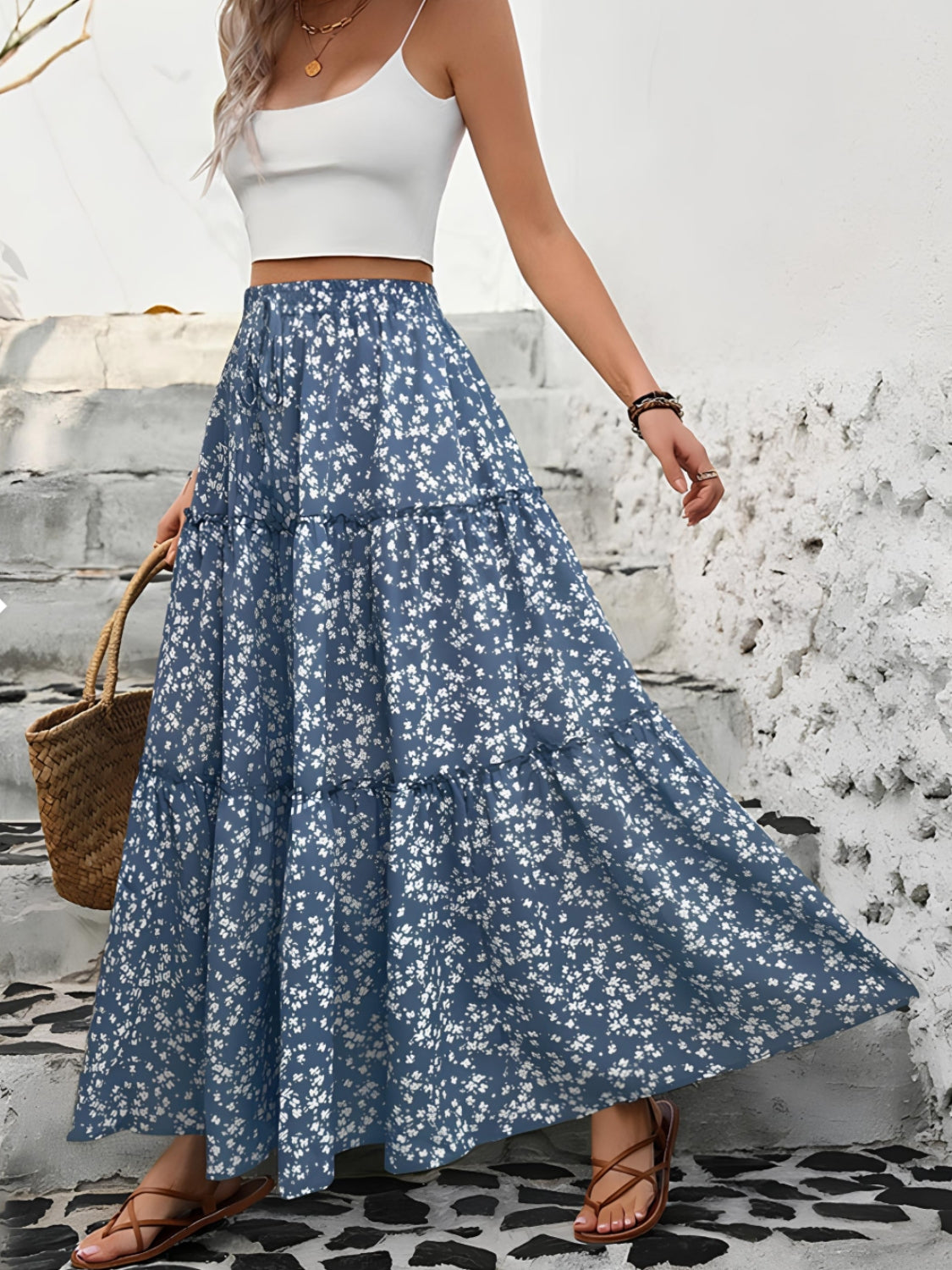 "Elegant tiered floral maxi skirt featuring a vibrant floral pattern, flowy design, and a flattering tiered silhouette for a chic, boho-inspired look"