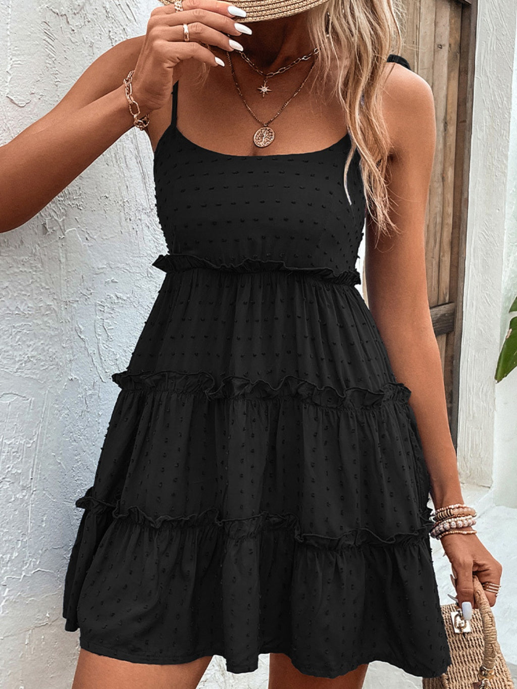"Elegant shiny spaghetti strap tiered dress with frill details, perfect for a night out or special occasion, offering a flattering and flowy fit."