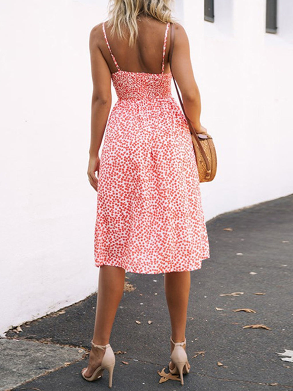 "Chic cutout sweetheart neckline cami dress with decorative button details. Flirty and feminine style, perfect for casual or evening outings."