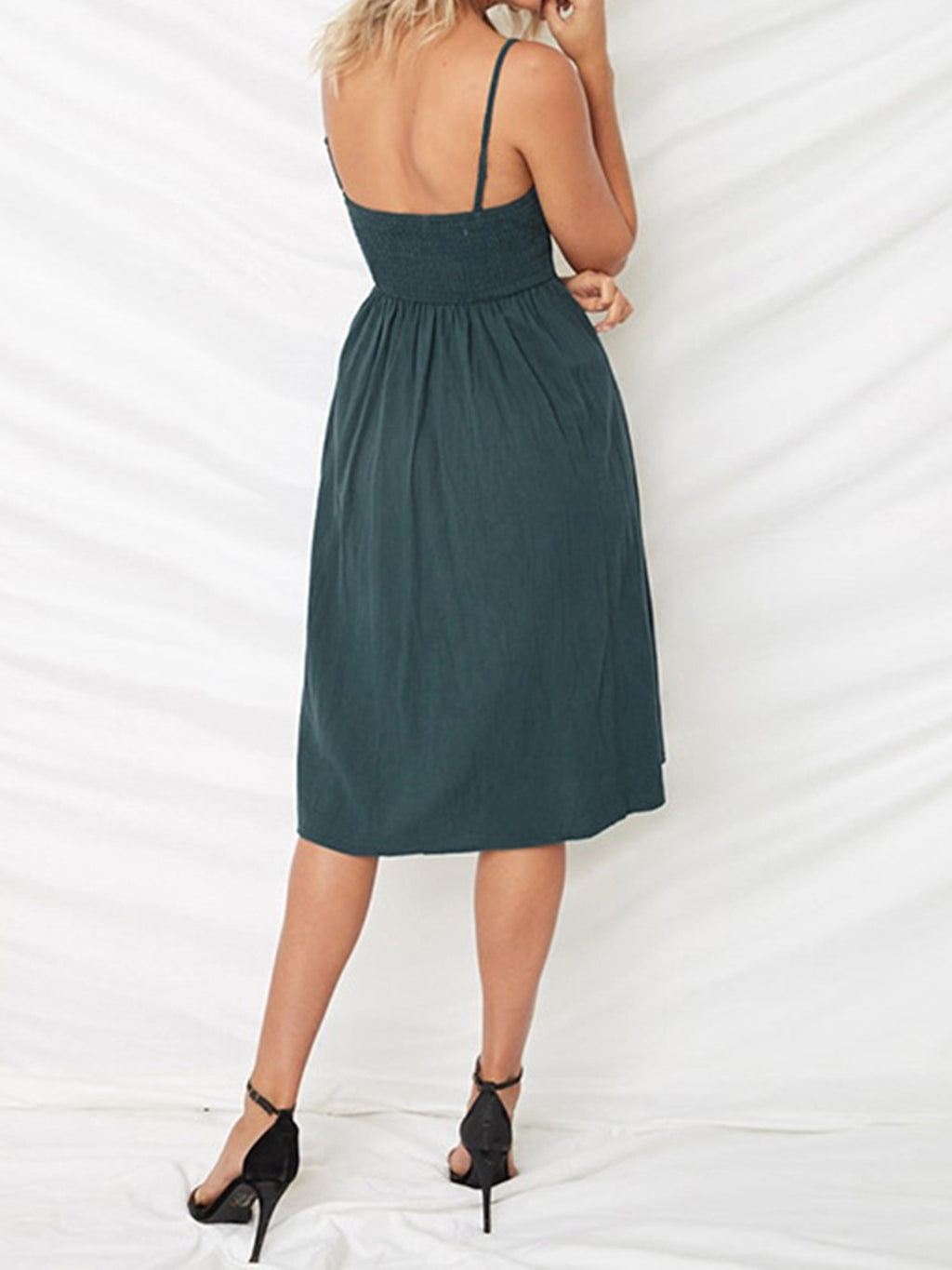 "Chic cutout sweetheart neckline cami dress with decorative button details. Flirty and feminine style, perfect for casual or evening outings."