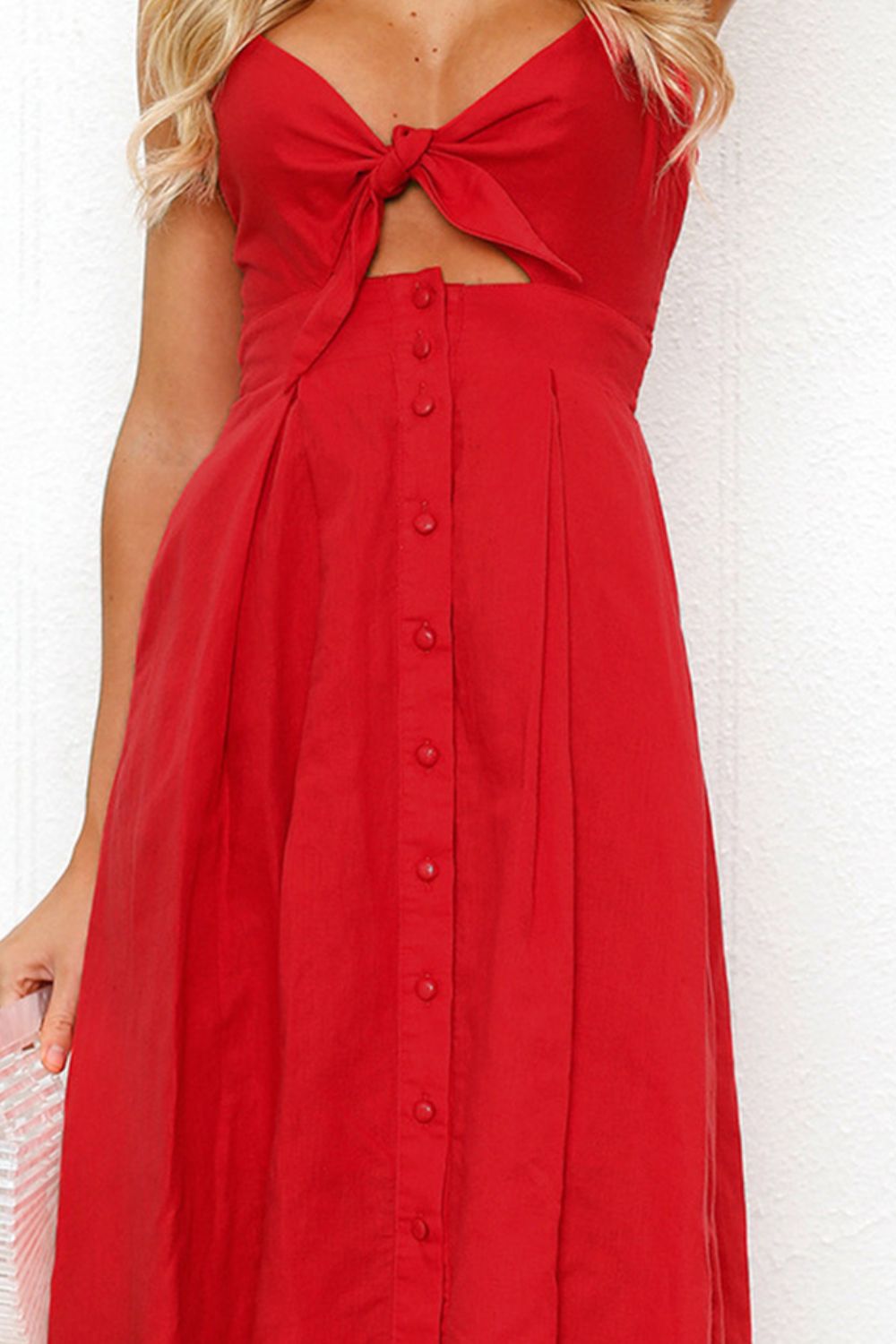 "Chic cutout sweetheart neckline cami dress with decorative button details. Flirty and feminine style, perfect for casual or evening outings."