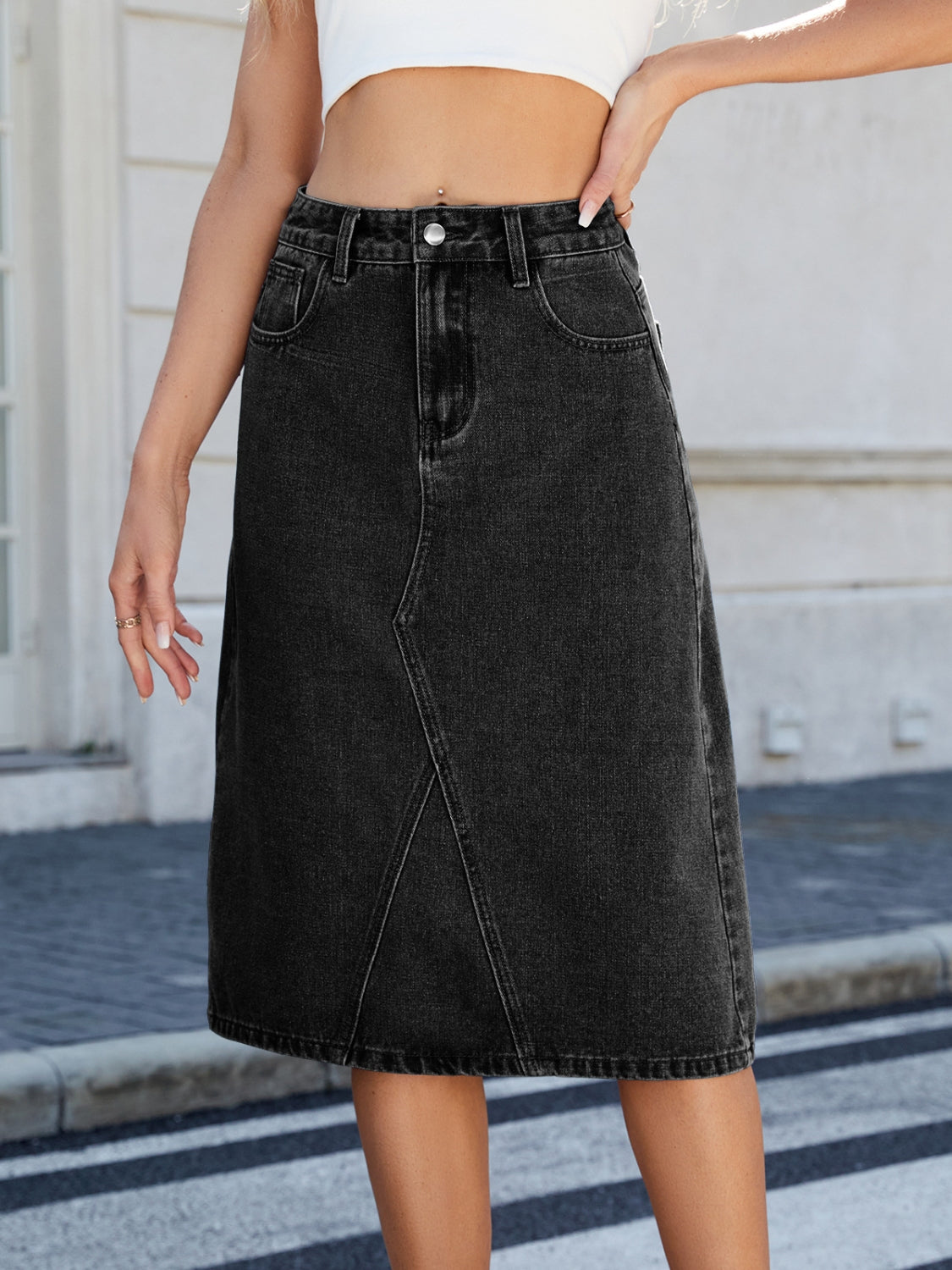 "Women's slit back denim skirt, trendy and chic, with a sleek fit and raw hem detail, perfect for casual wear or dressed-up outfits, versatile and stylish"