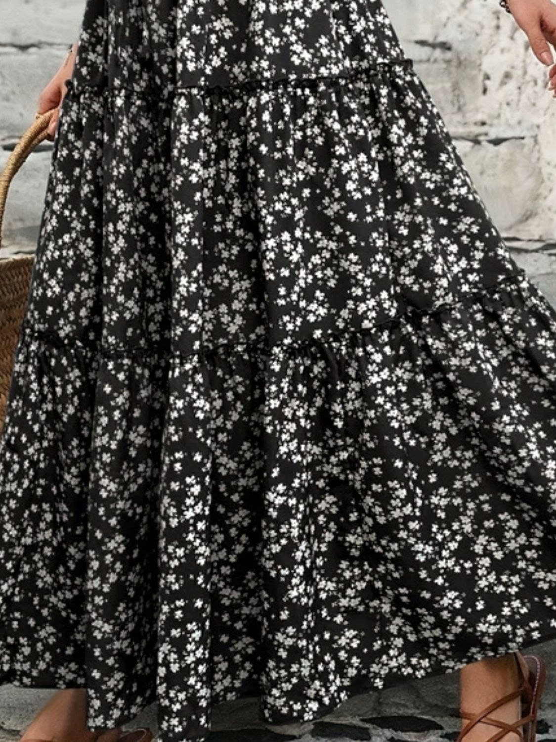 "Elegant tiered floral maxi skirt featuring a vibrant floral pattern, flowy design, and a flattering tiered silhouette for a chic, boho-inspired look"