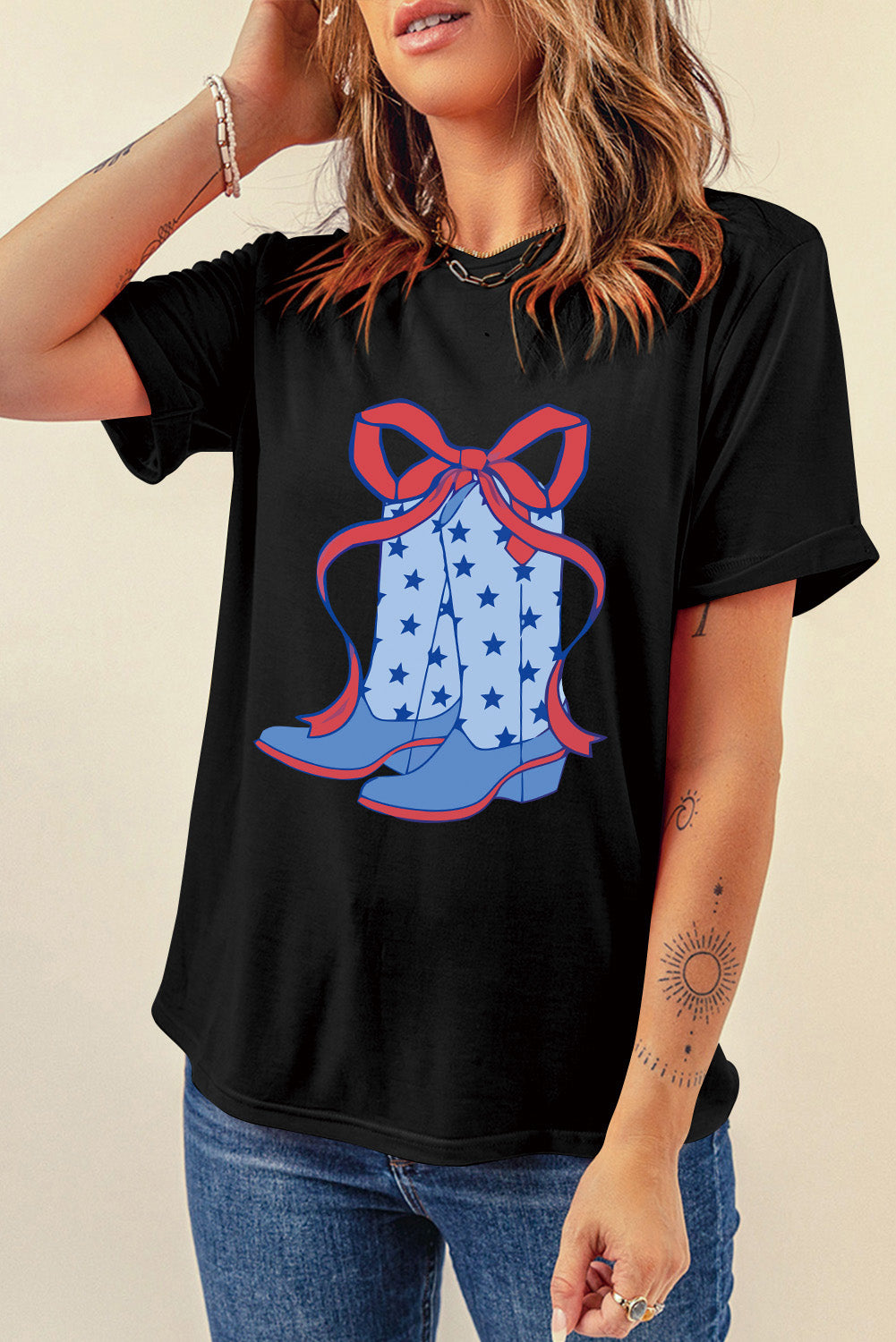 "Boots & Bow Tee – Western-inspired graphic t-shirt with a mix of cowboy charm and feminine flair, perfect for country lovers."
