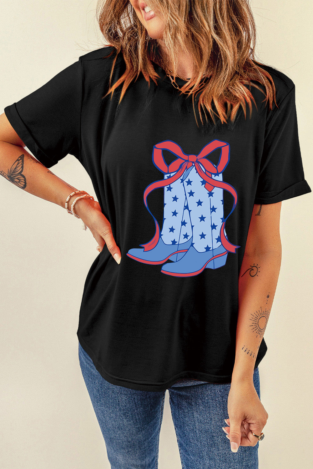 "Boots & Bow Tee – Western-inspired graphic t-shirt with a mix of cowboy charm and feminine flair, perfect for country lovers."