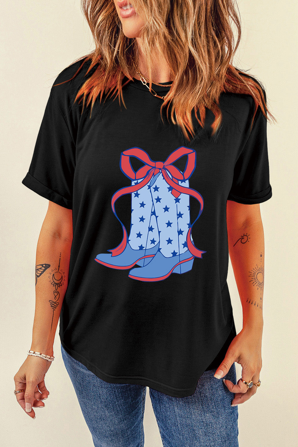 "Boots & Bow Tee – Western-inspired graphic t-shirt with a mix of cowboy charm and feminine flair, perfect for country lovers."
