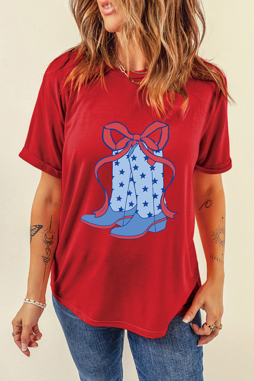 "Boots & Bow Tee – Western-inspired graphic t-shirt with a mix of cowboy charm and feminine flair, perfect for country lovers."