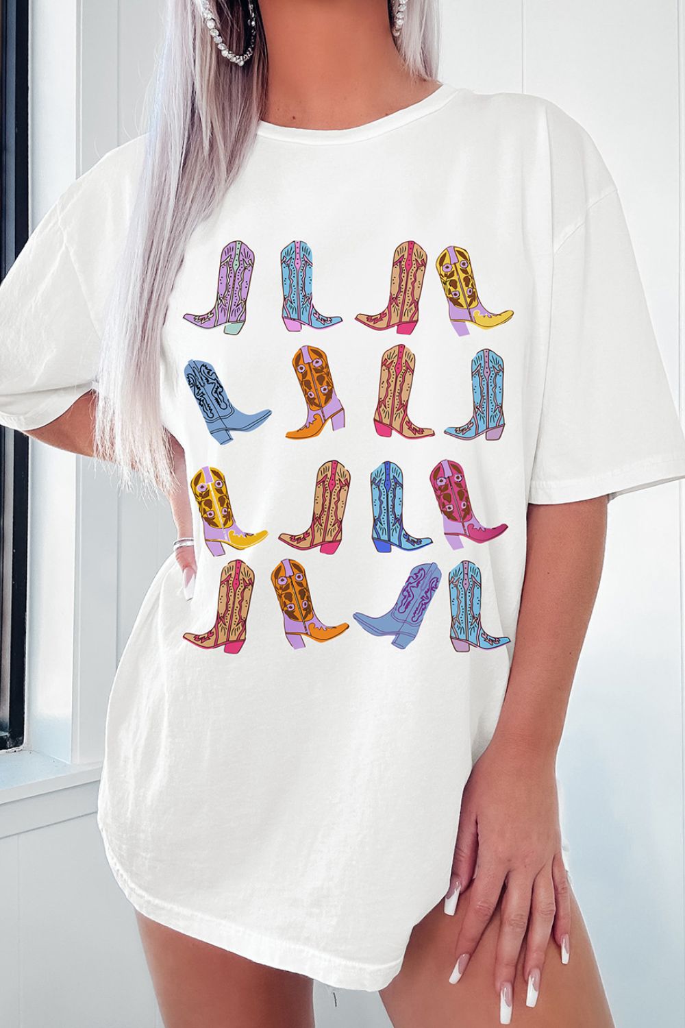 "Boots Oversized Tee – Western-inspired oversized t-shirt featuring a bold cowboy boots graphic, perfect for country lovers."