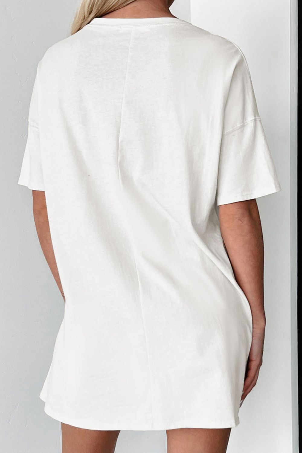 "Boots Oversized Tee – Western-inspired oversized t-shirt featuring a bold cowboy boots graphic, perfect for country lovers."