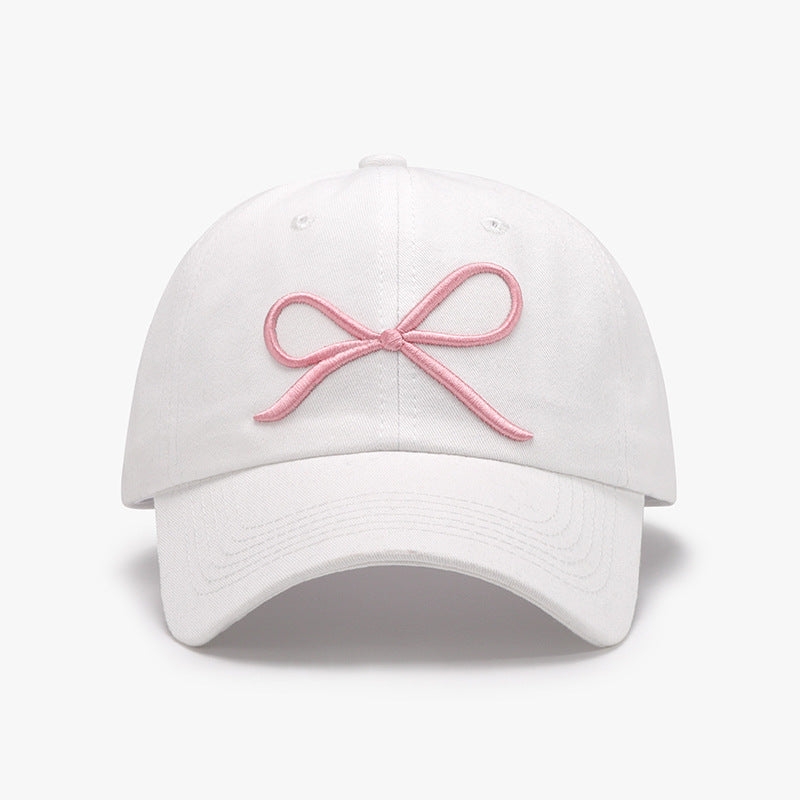 "Bow Baseball Cap – Stylish and adjustable cap featuring a chic bow detail, perfect for a sporty yet feminine look."