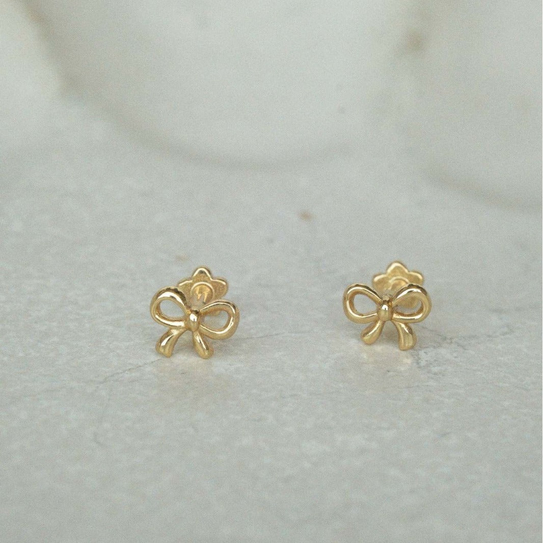 "Bow Stud Earrings – Elegant and dainty bow-shaped stud earrings, perfect for adding a touch of femininity and charm to any outfit."