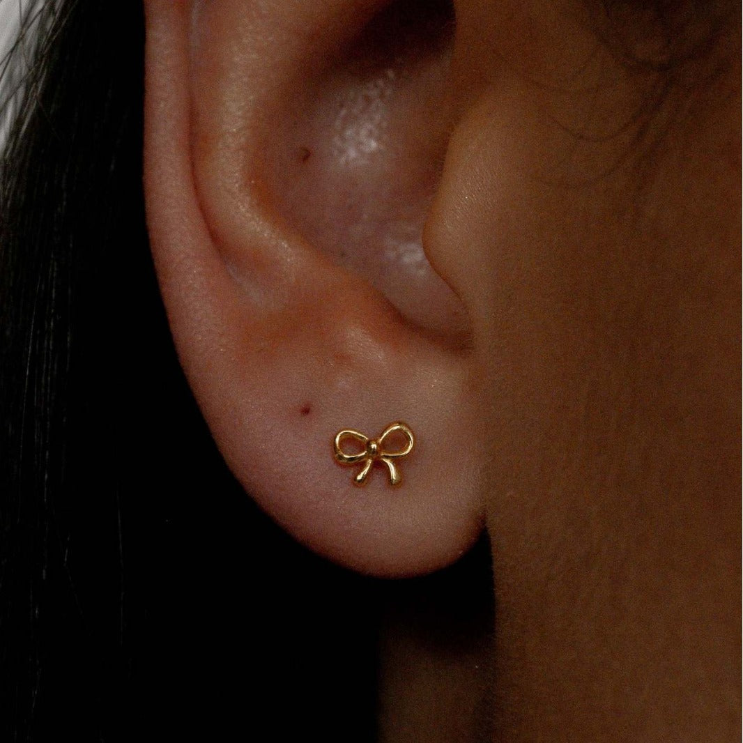 "Bow Stud Earrings – Elegant and dainty bow-shaped stud earrings, perfect for adding a touch of femininity and charm to any outfit."