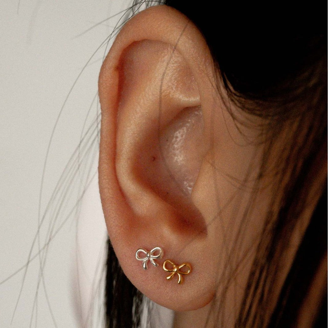 "Bow Stud Earrings – Elegant and dainty bow-shaped stud earrings, perfect for adding a touch of femininity and charm to any outfit."