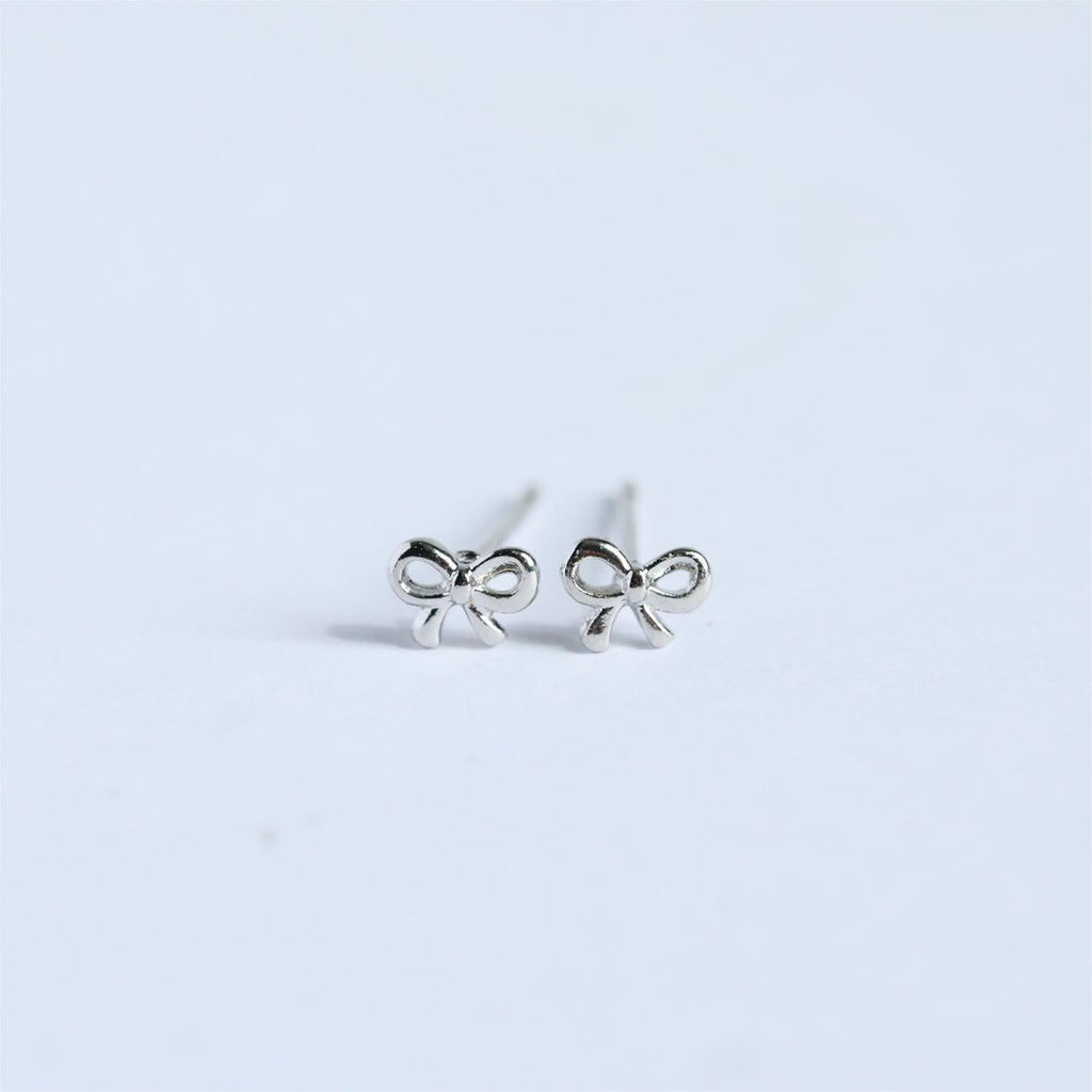 "Bow Stud Earrings – Elegant and dainty bow-shaped stud earrings, perfect for adding a touch of femininity and charm to any outfit."