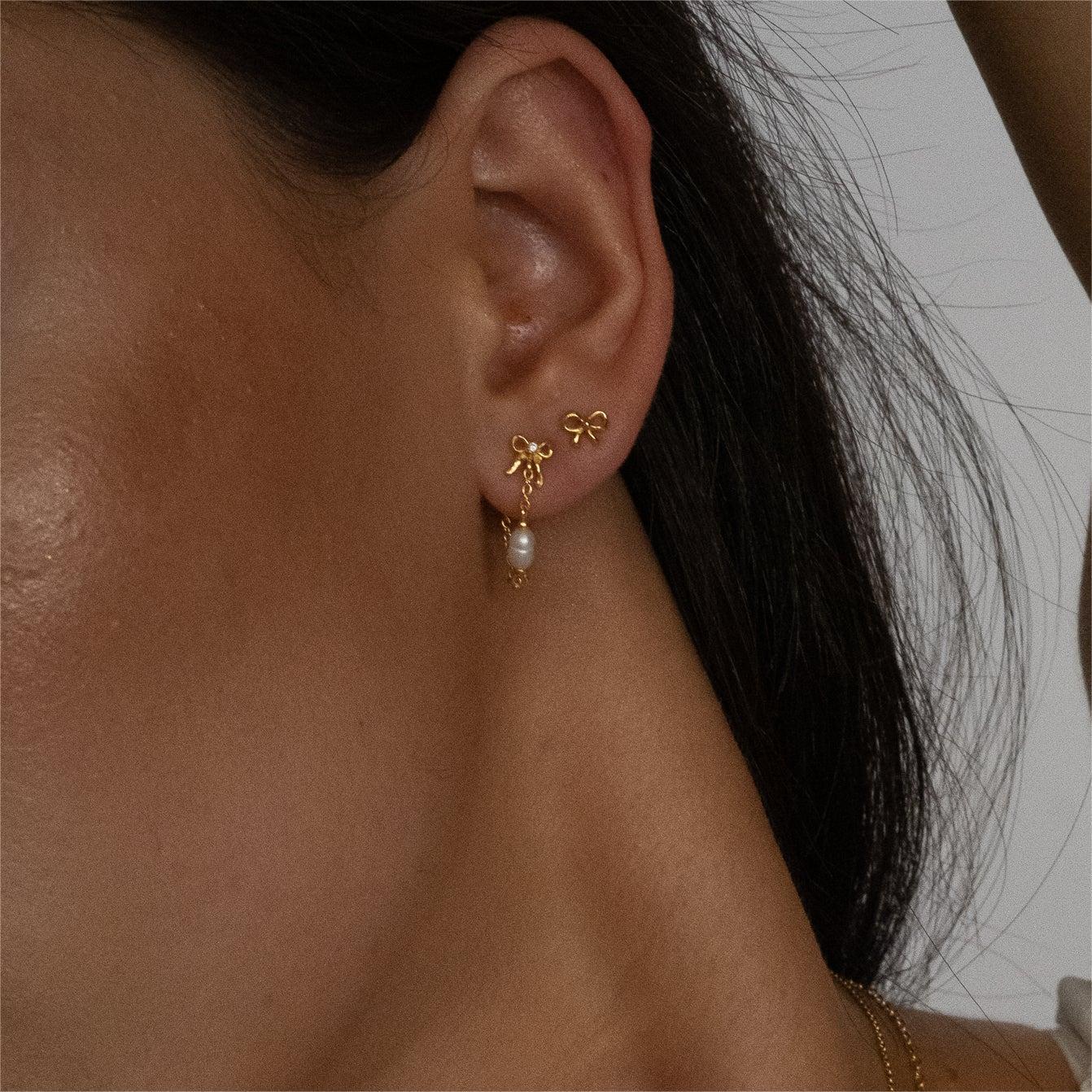"Bow Stud Earrings – Elegant and dainty bow-shaped stud earrings, perfect for adding a touch of femininity and charm to any outfit."
