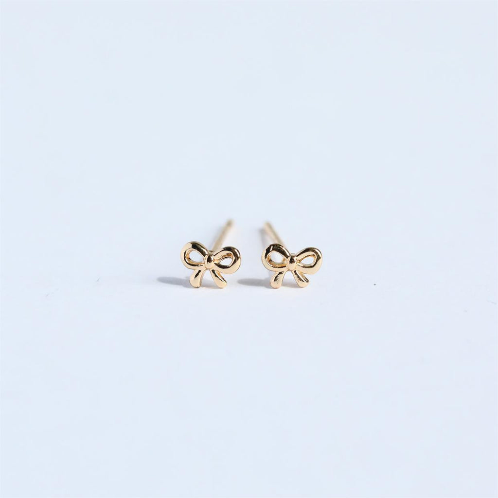 "Bow Stud Earrings – Elegant and dainty bow-shaped stud earrings, perfect for adding a touch of femininity and charm to any outfit."