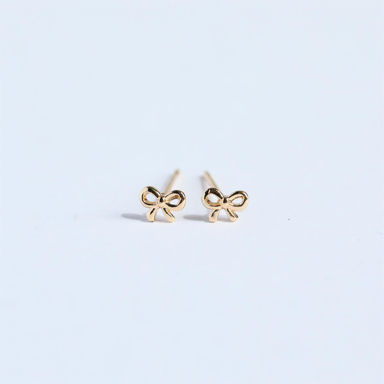 "Bow Stud Earrings – Elegant and dainty bow-shaped stud earrings, perfect for adding a touch of femininity and charm to any outfit."