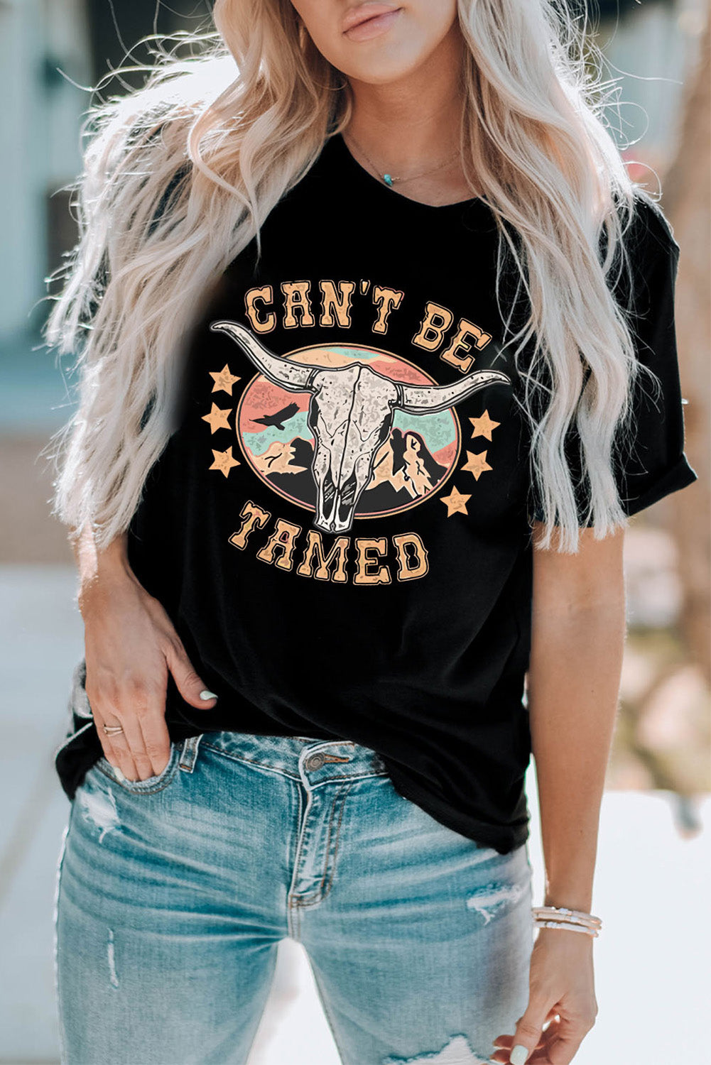Can’t Be Tamed Tee – Bold and fearless graphic t-shirt with a relaxed fit, perfect for making a statement."
