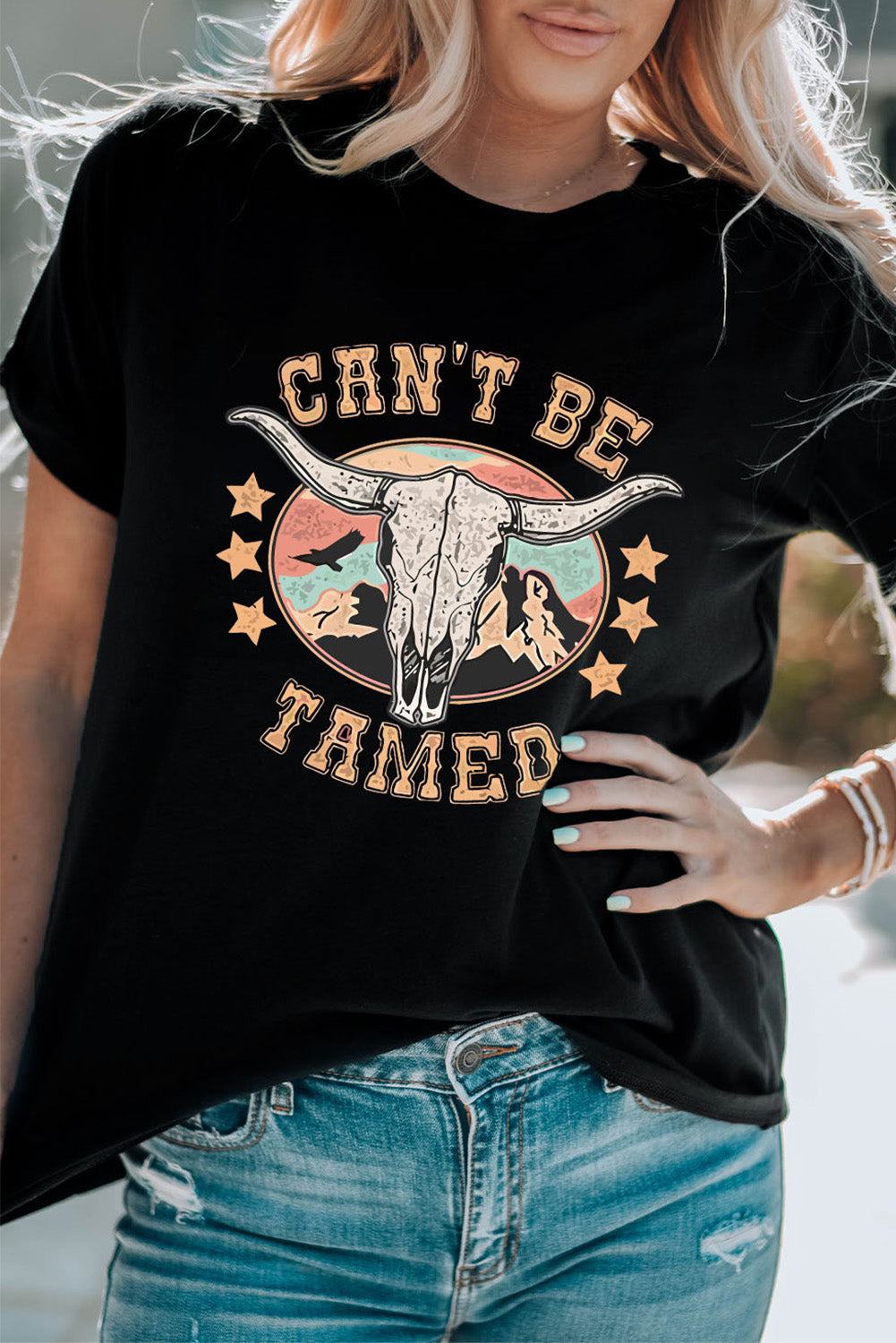 Can’t Be Tamed Tee – Bold and fearless graphic t-shirt with a relaxed fit, perfect for making a statement."
