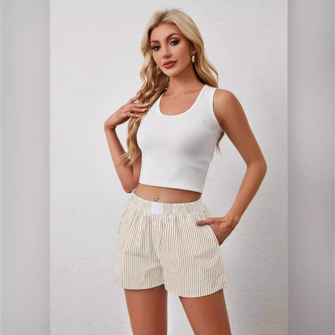 "Casual striped shorts for women – stylish summer wear, breathable polyester fabric, available in blue, yellow, and emerald green. Perfect for warm-weather outfits."