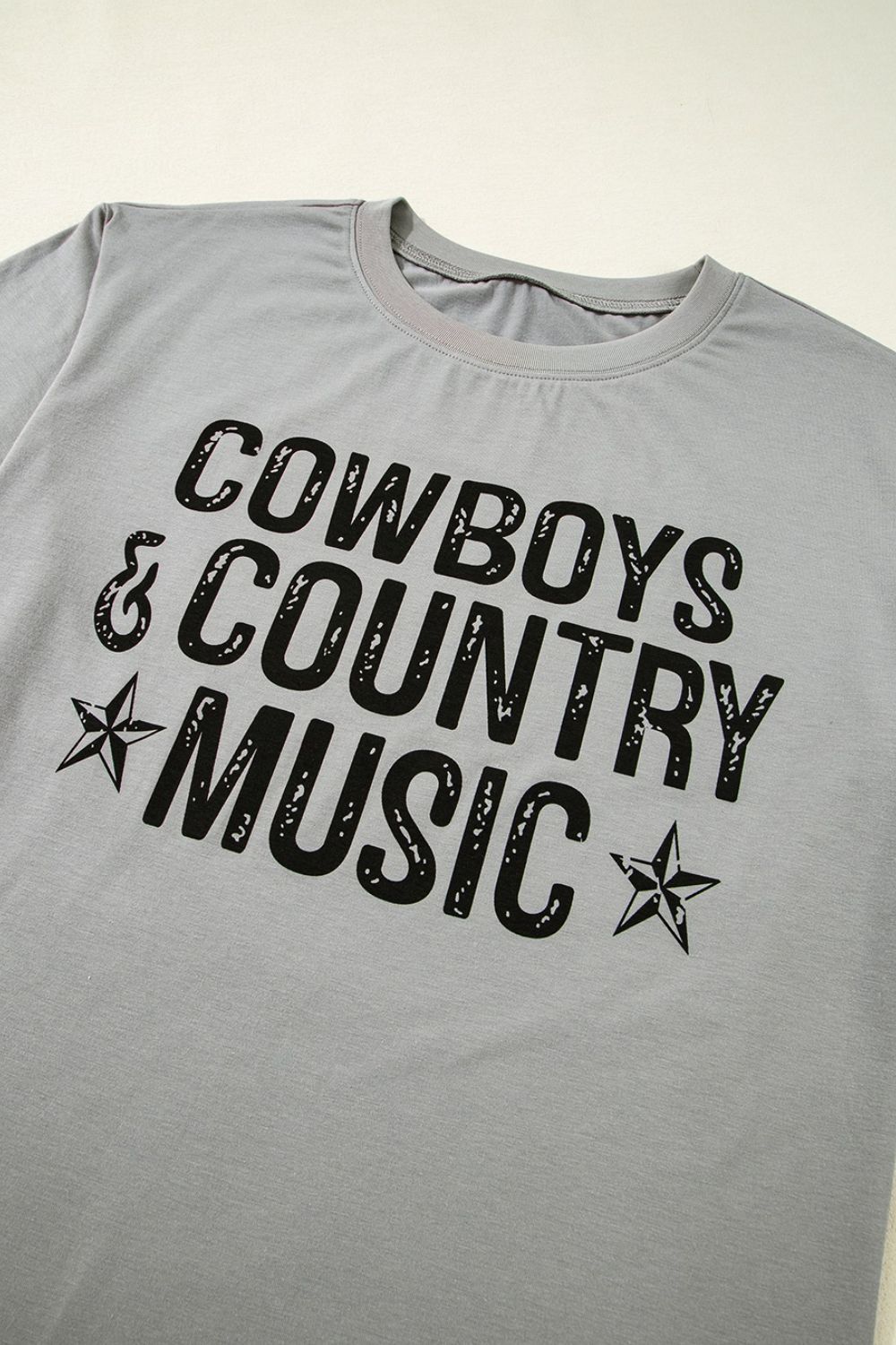 "Cowboys & Country Music Tee – Western-inspired graphic t-shirt for country music lovers and cowboy spirit."