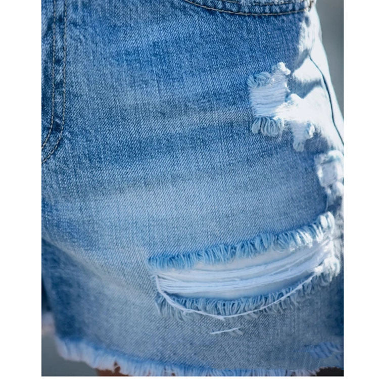 "Fringed denim shorts - stylish blue mid-waist summer shorts for women, casual straight-leg cut with trendy frayed hem."