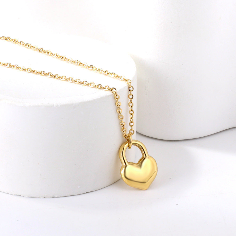 "Golden Love Heart Necklace with heart-shaped padlock pendant, gold-plated stainless steel chain, perfect gift for love and commitment."