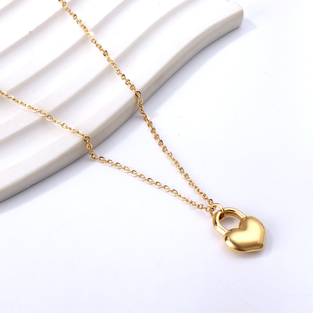 "Golden Love Heart Necklace with heart-shaped padlock pendant, gold-plated stainless steel chain, perfect gift for love and commitment."
