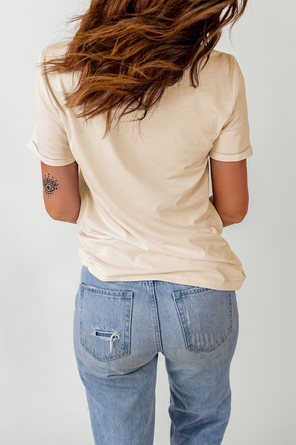 "Women's Howdy Cow Print Tee featuring a playful cow print graphic, round neckline, and short sleeves for a casual, country-inspired look."