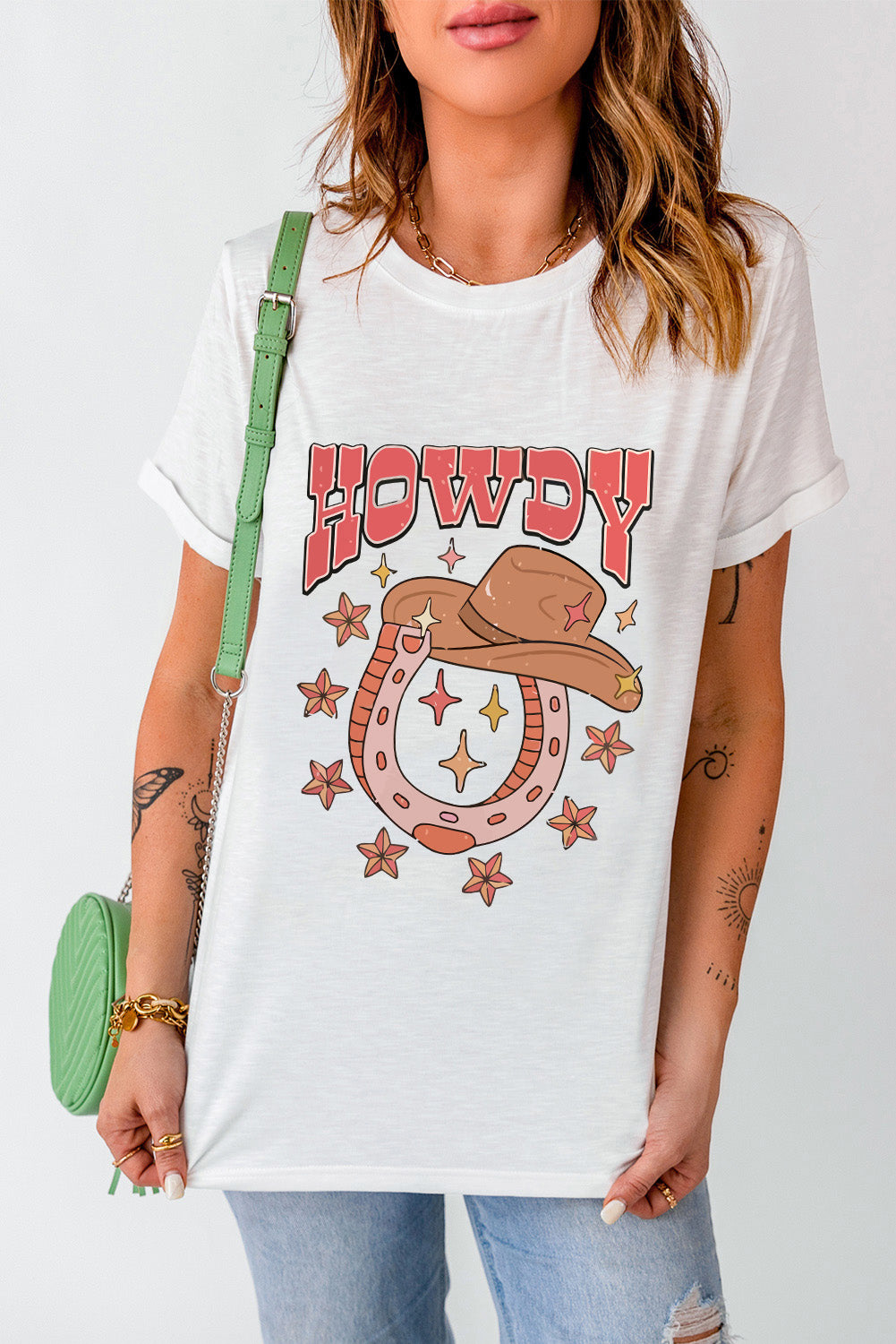 "Howdy Hat & Horseshoe Tee – Western-inspired t-shirt featuring a cowboy hat and lucky horseshoe design, perfect for country lovers."