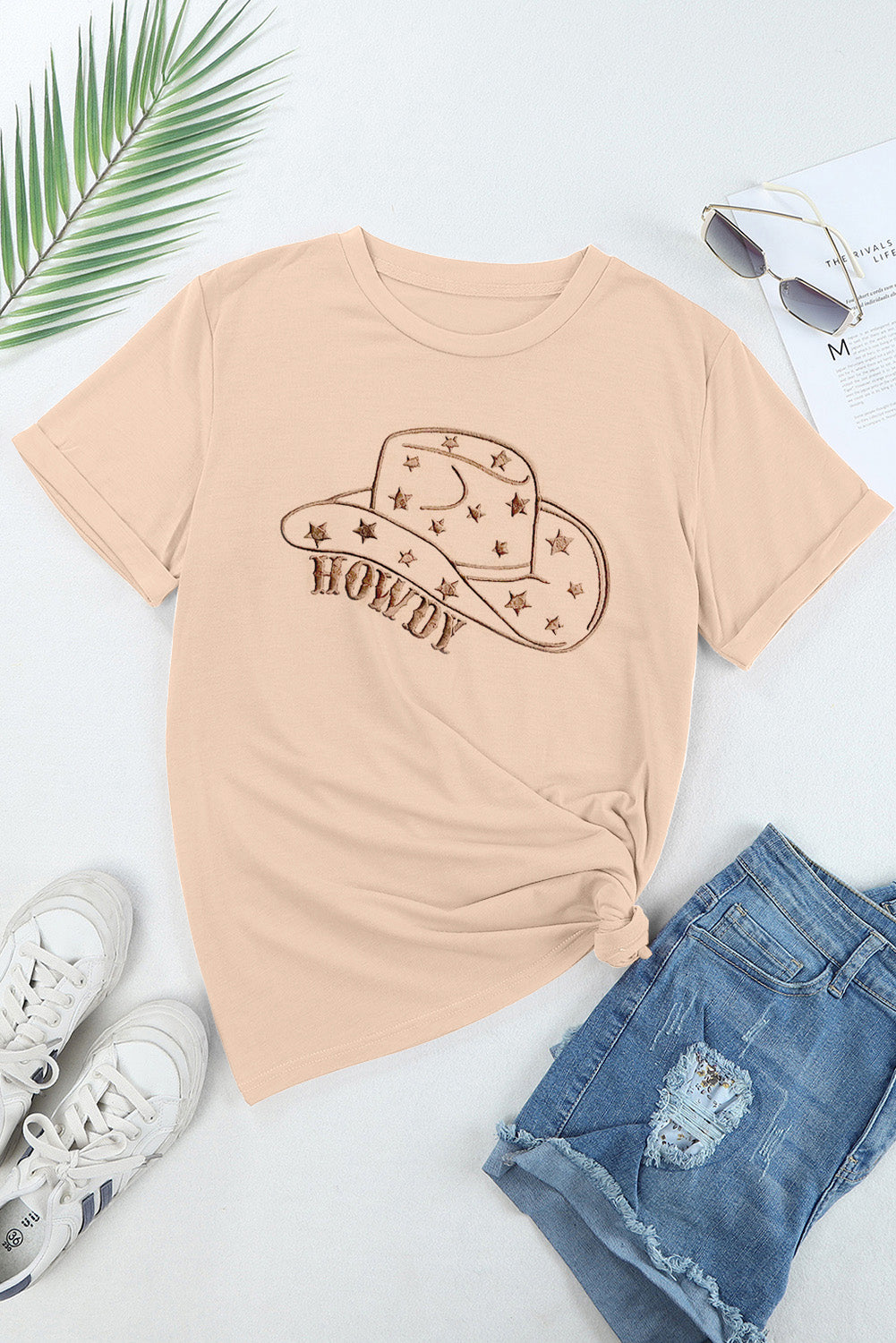 "Howdy Hat Tee – Western-inspired graphic t-shirt featuring a cowboy hat and bold ‘Howdy’ text for a classic country look."