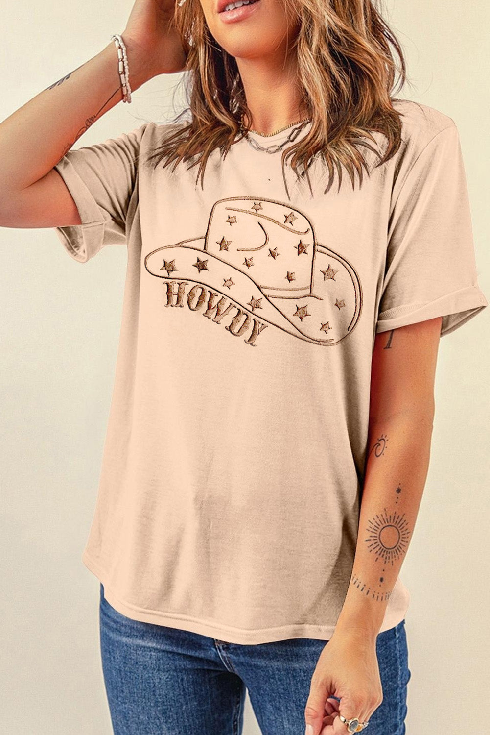 "Howdy Hat Tee – Western-inspired graphic t-shirt featuring a cowboy hat and bold ‘Howdy’ text for a classic country look."