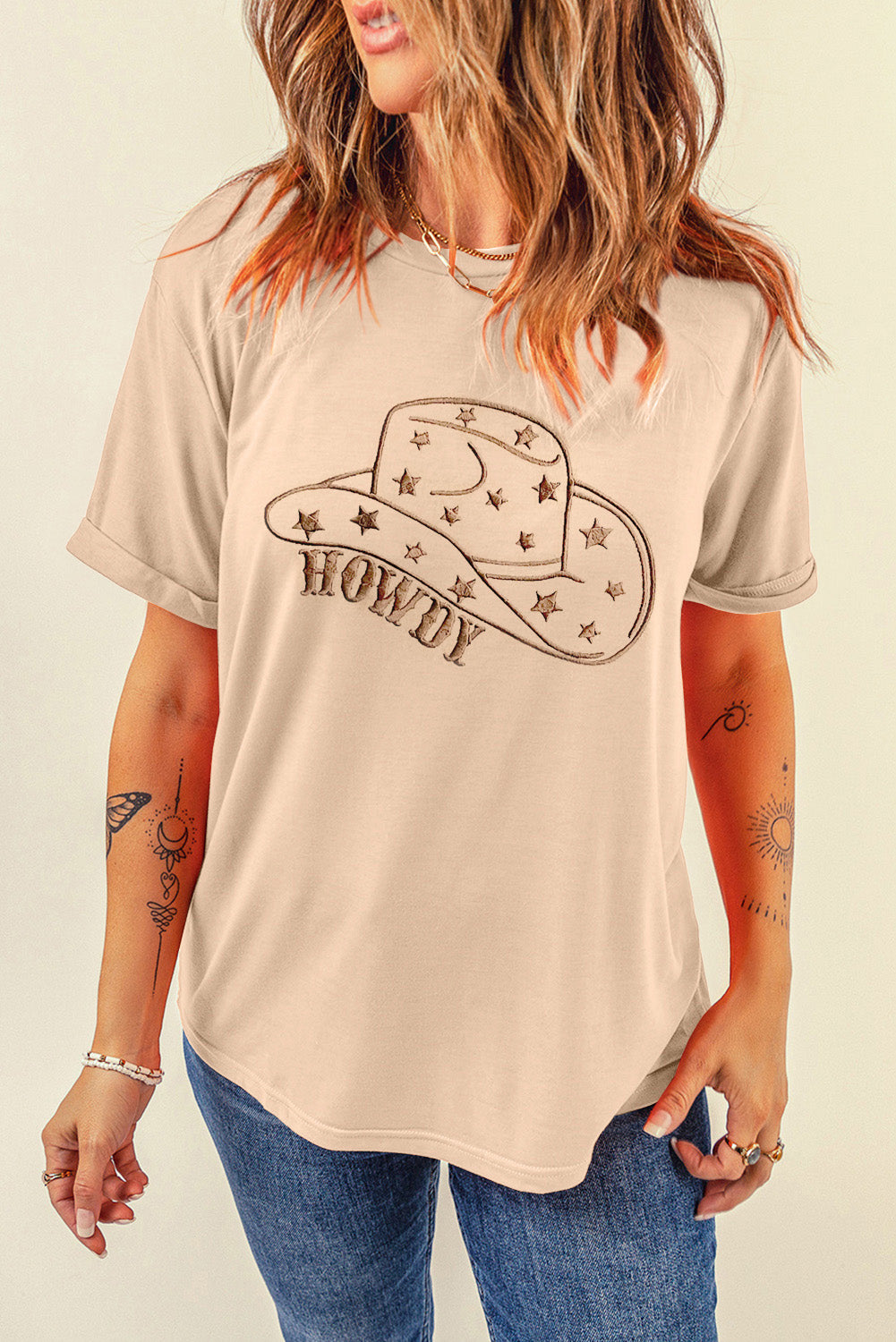 "Howdy Hat Tee – Western-inspired graphic t-shirt featuring a cowboy hat and bold ‘Howdy’ text for a classic country look."