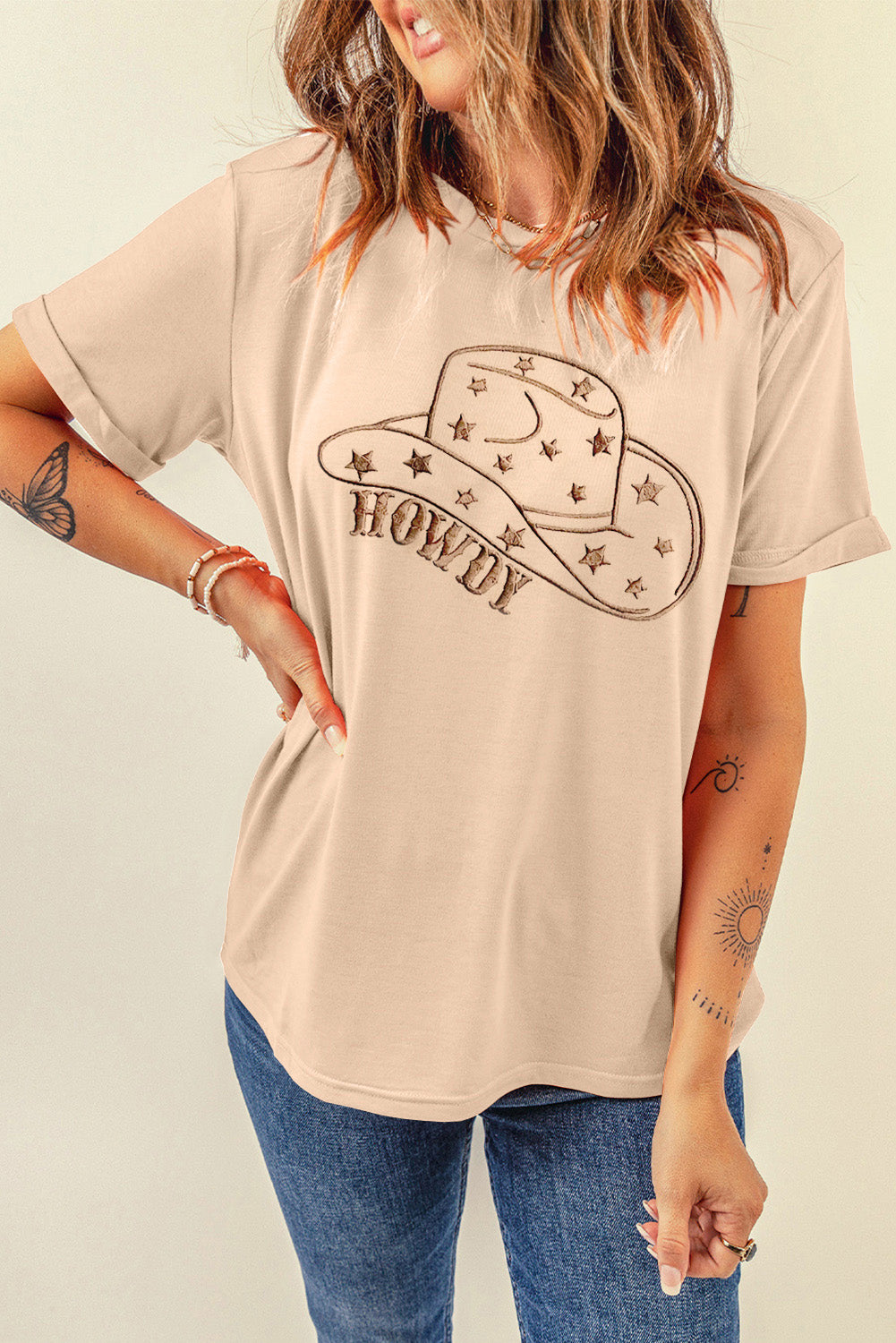 "Howdy Hat Tee – Western-inspired graphic t-shirt featuring a cowboy hat and bold ‘Howdy’ text for a classic country look."