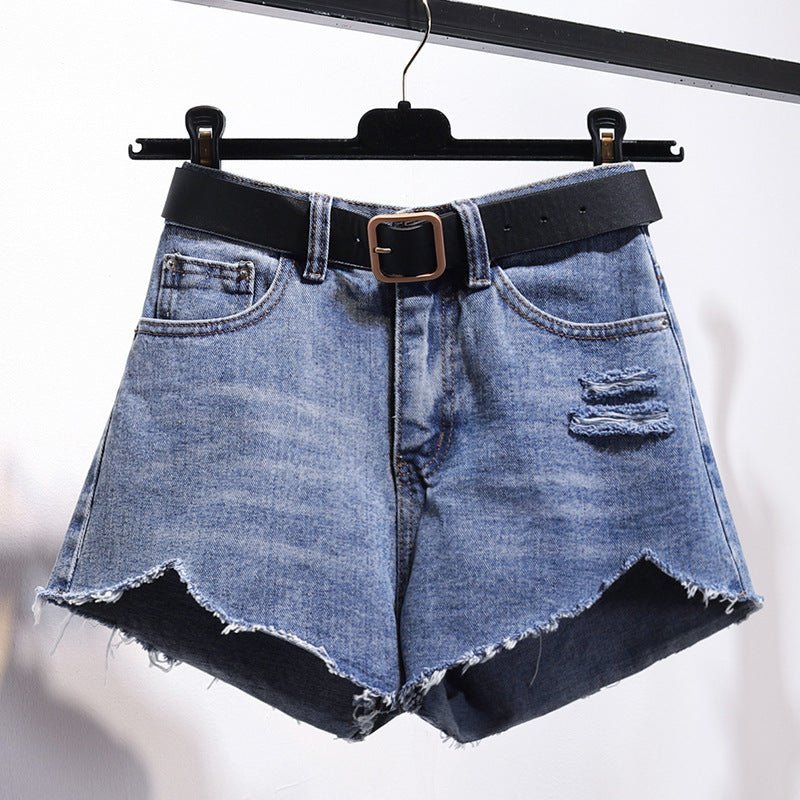"Irregular denim shorts with asymmetrical cut and raw-edge details, stylish cotton denim shorts for a trendy streetwear look."