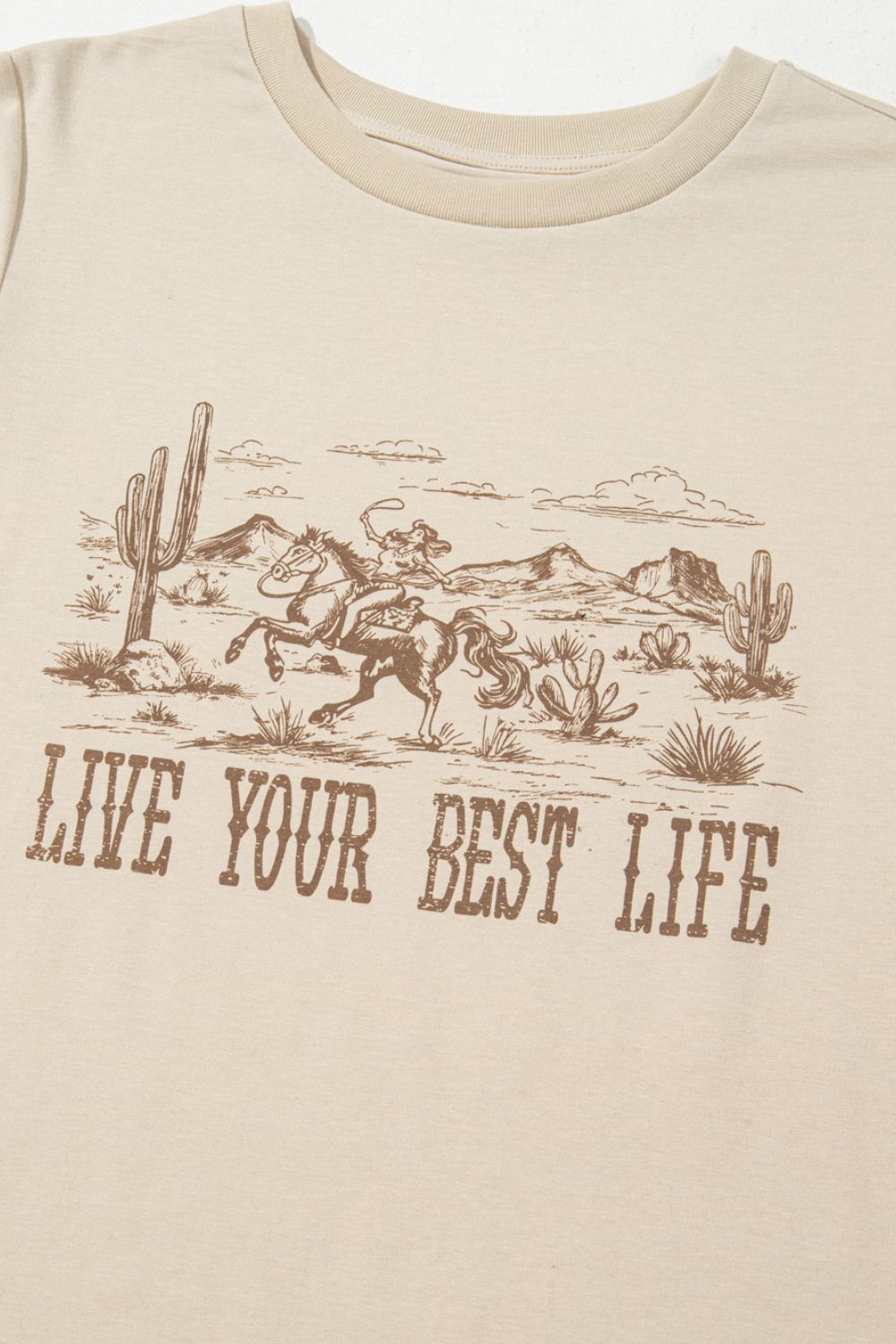 "Live Your Best Life Tee – Inspirational graphic t-shirt with a positive message, perfect for everyday wear."
