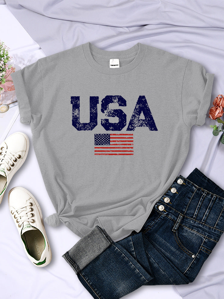 Classic USA Tee with bold lettering on breathable cotton fabric, perfect for showing American pride."
