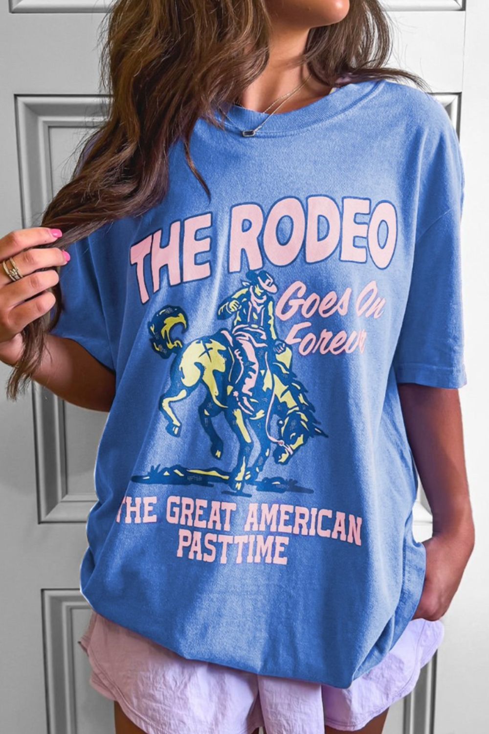 "Rodeo Goes On Forever Tee – Western-inspired graphic t-shirt celebrating the timeless spirit of the rodeo."