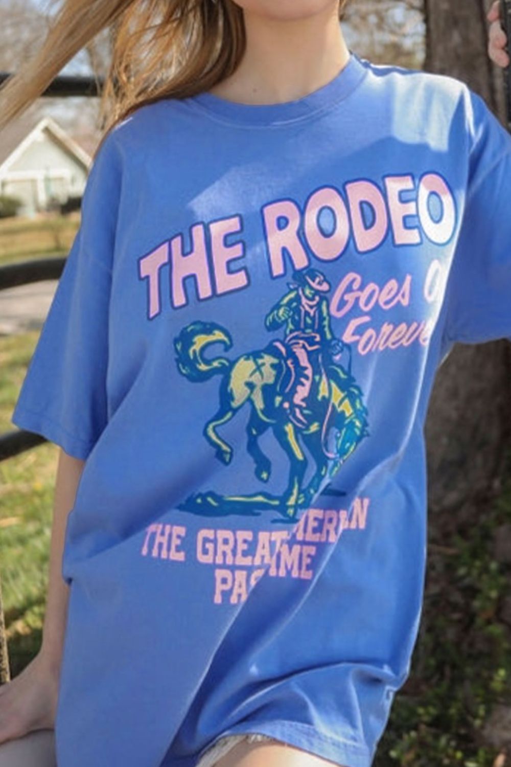 "Rodeo Goes On Forever Tee – Western-inspired graphic t-shirt celebrating the timeless spirit of the rodeo."