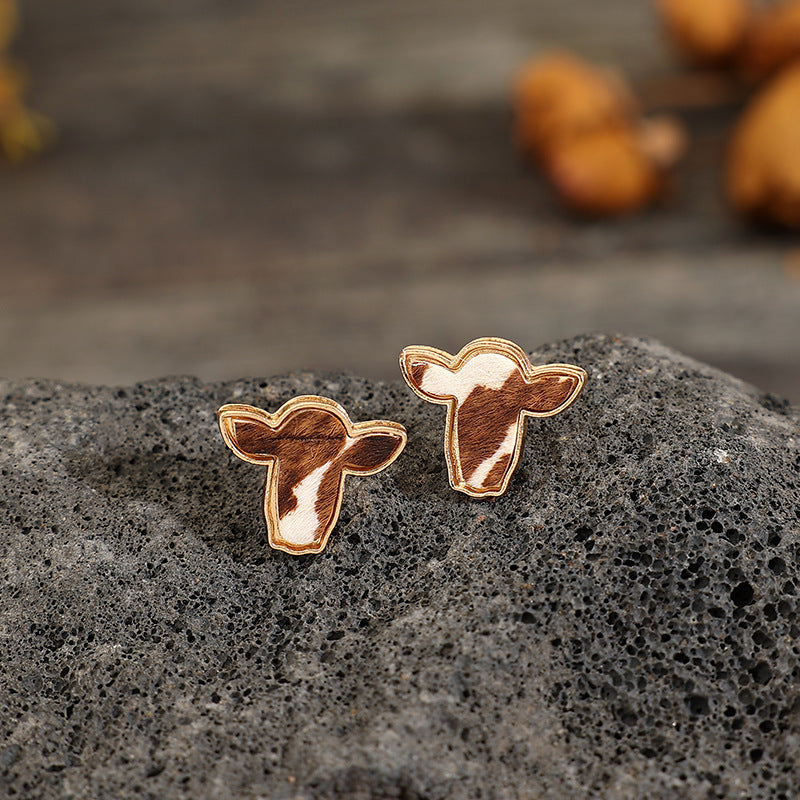 "Trendy cattle head earrings with rustic Western charm, perfect for adding a bold and stylish statement to any outfit."
