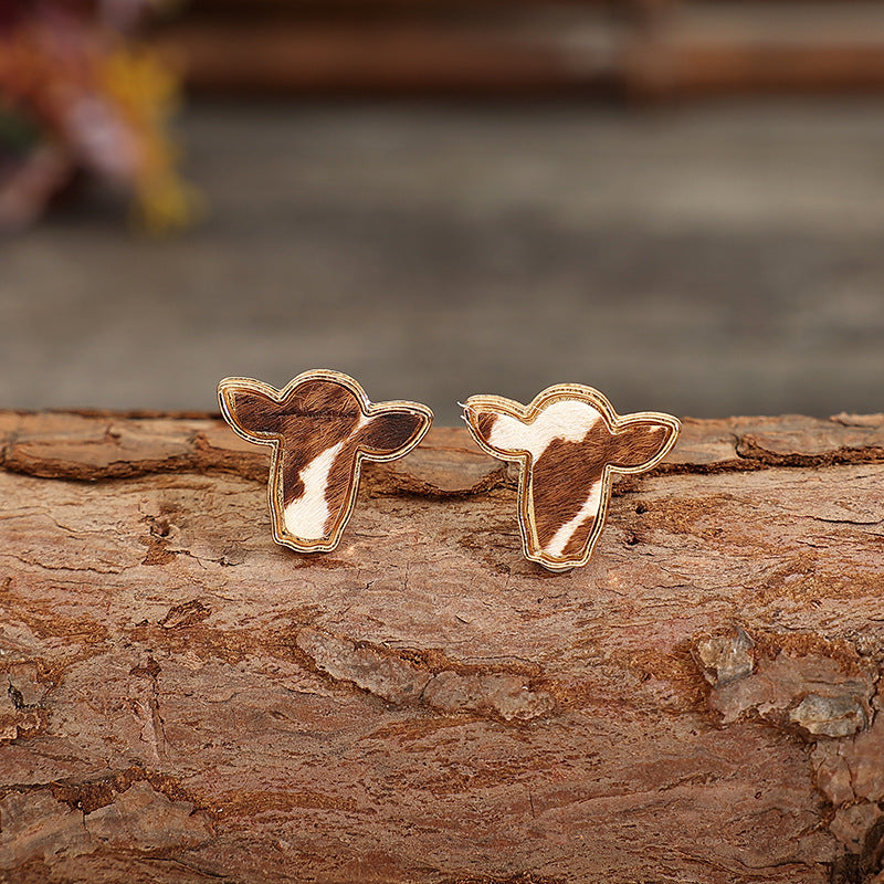 "Trendy cattle head earrings with rustic Western charm, perfect for adding a bold and stylish statement to any outfit."