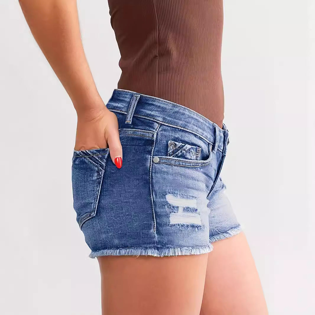 "Trendy ripped denim shorts – stylish street fashion, light blue distressed jean shorts for a chic casual look."