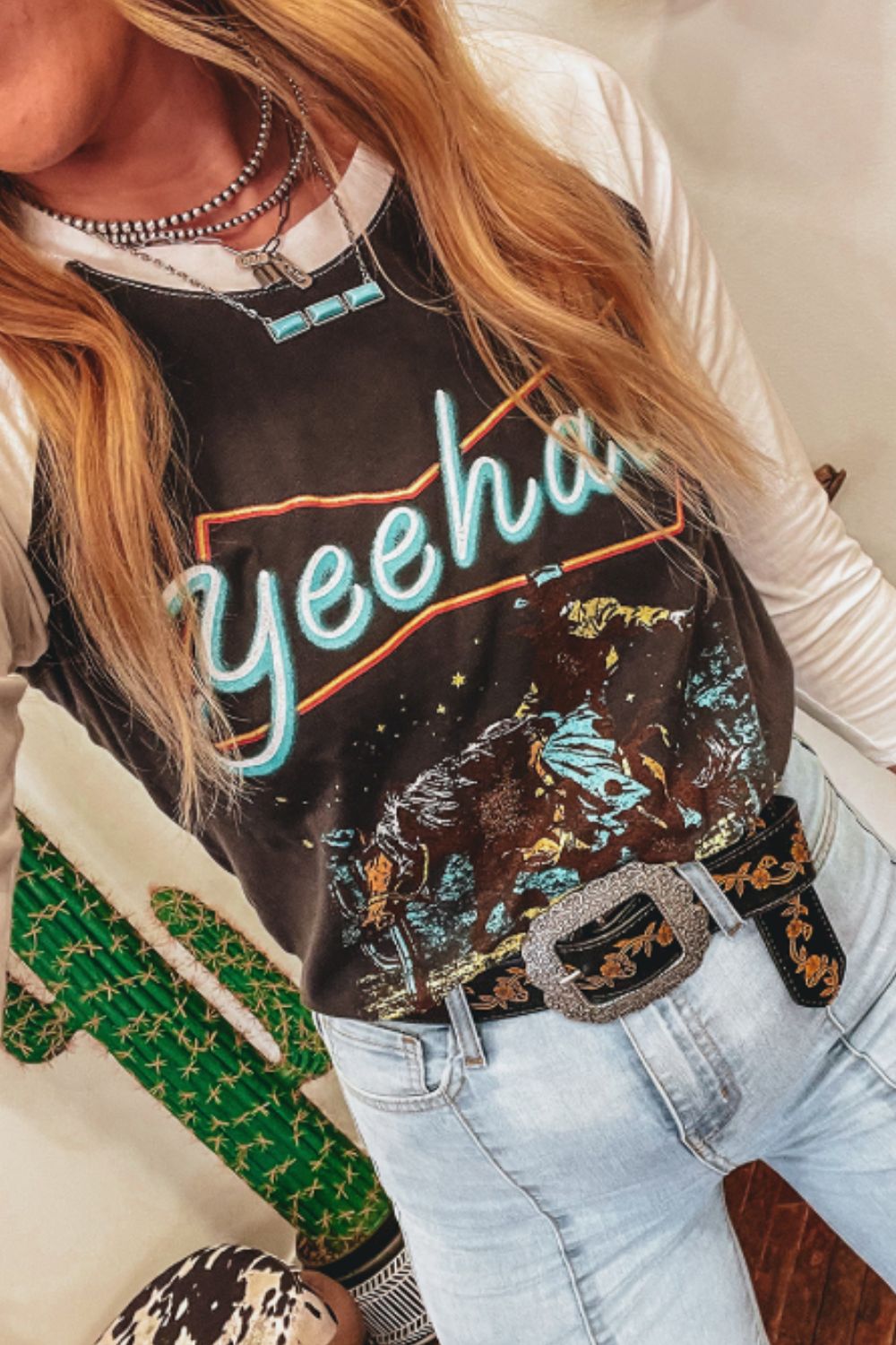 "Yeehaw Raglan Sleeve Tee – Retro Western graphic t-shirt with bold lettering and classic raglan sleeves."