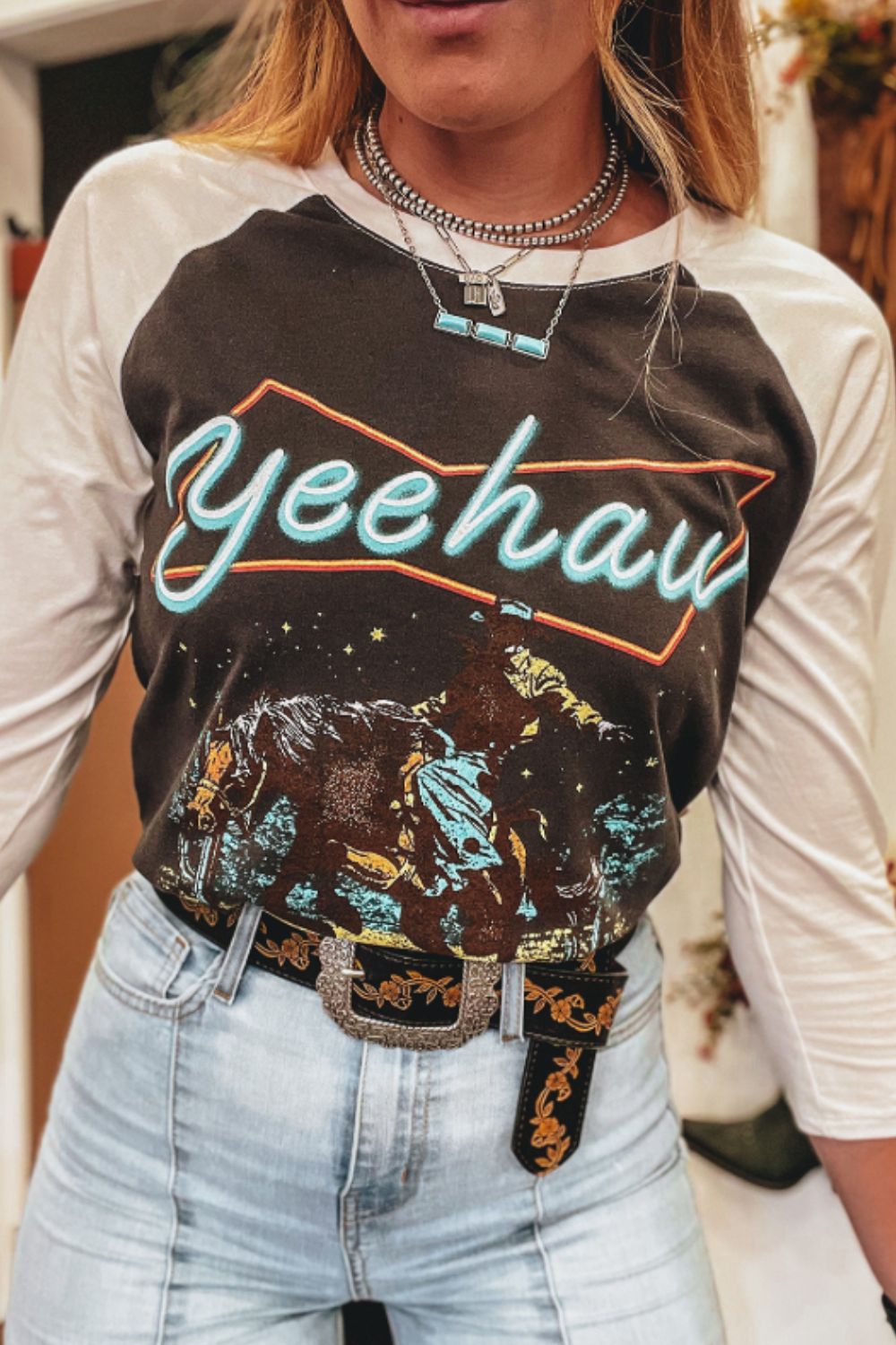 "Yeehaw Raglan Sleeve Tee – Retro Western graphic t-shirt with bold lettering and classic raglan sleeves."