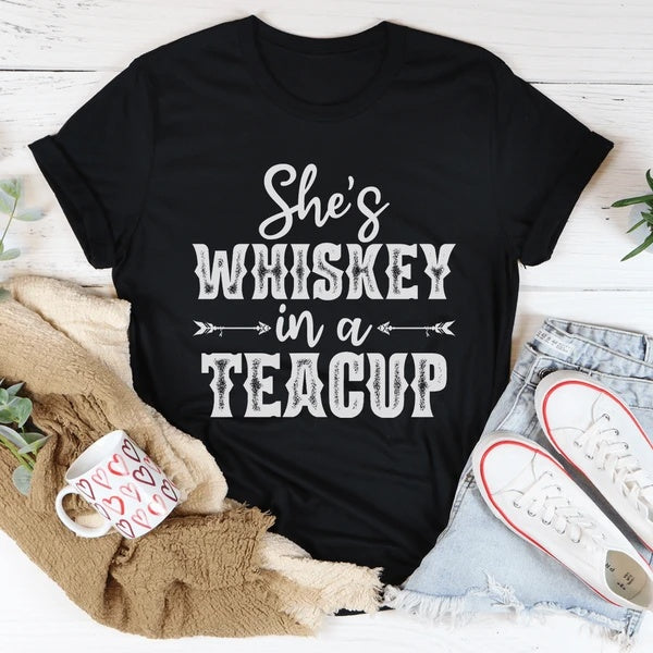 "Whiskey in a Teacup Graphic Tee featuring vintage-inspired typography on soft, breathable cotton for a bold and stylish look."