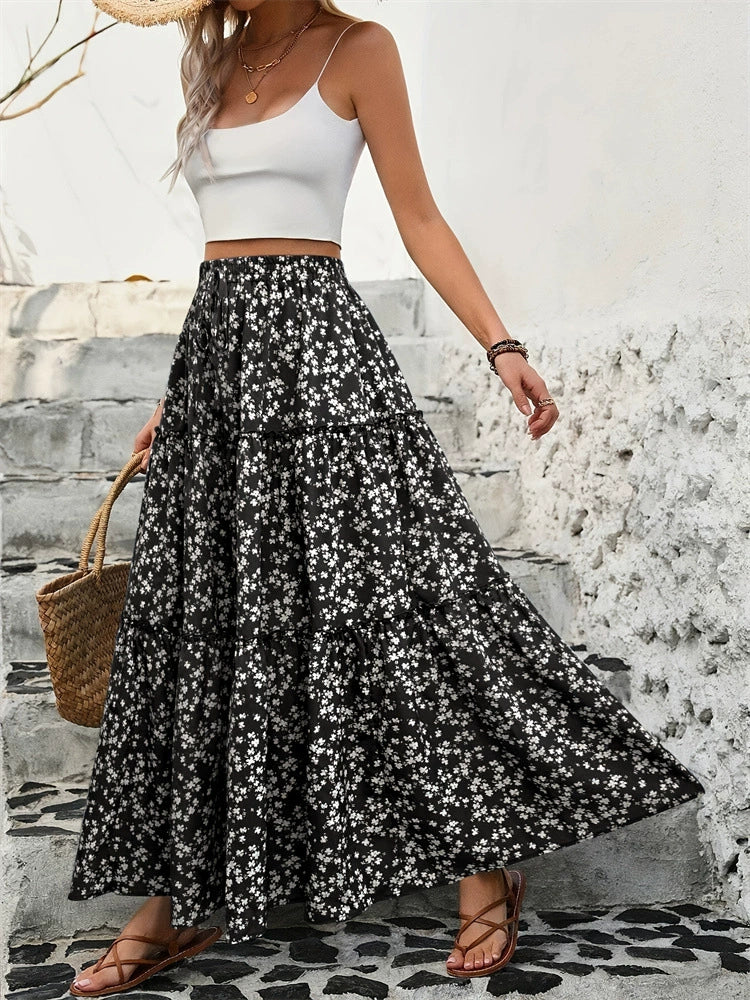 "Elegant tiered floral maxi skirt featuring a vibrant floral pattern, flowy design, and a flattering tiered silhouette for a chic, boho-inspired look"