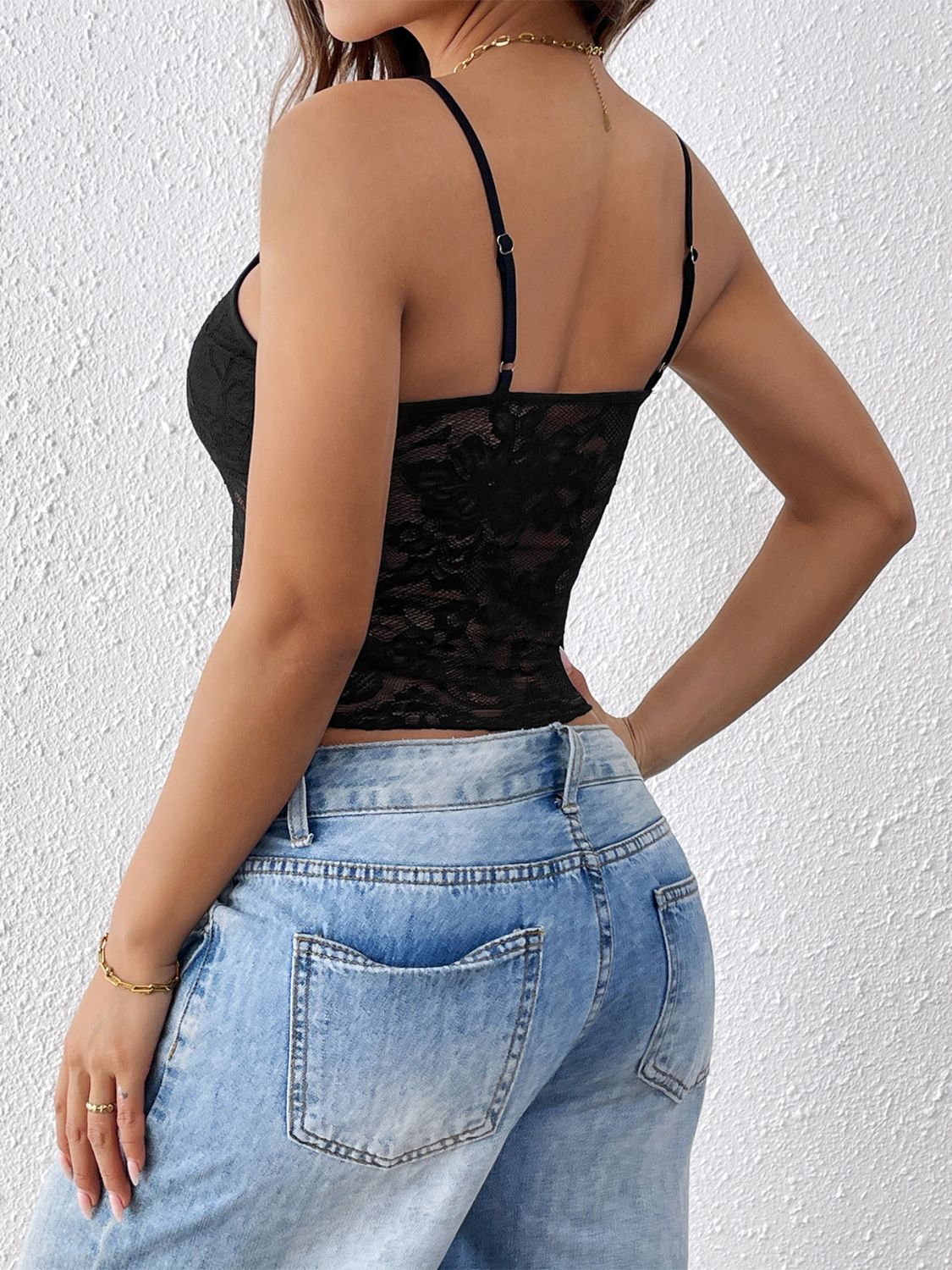 "Woman wearing a fringe tank top with tassel hem, ideal for festival outfits and casual boho style"