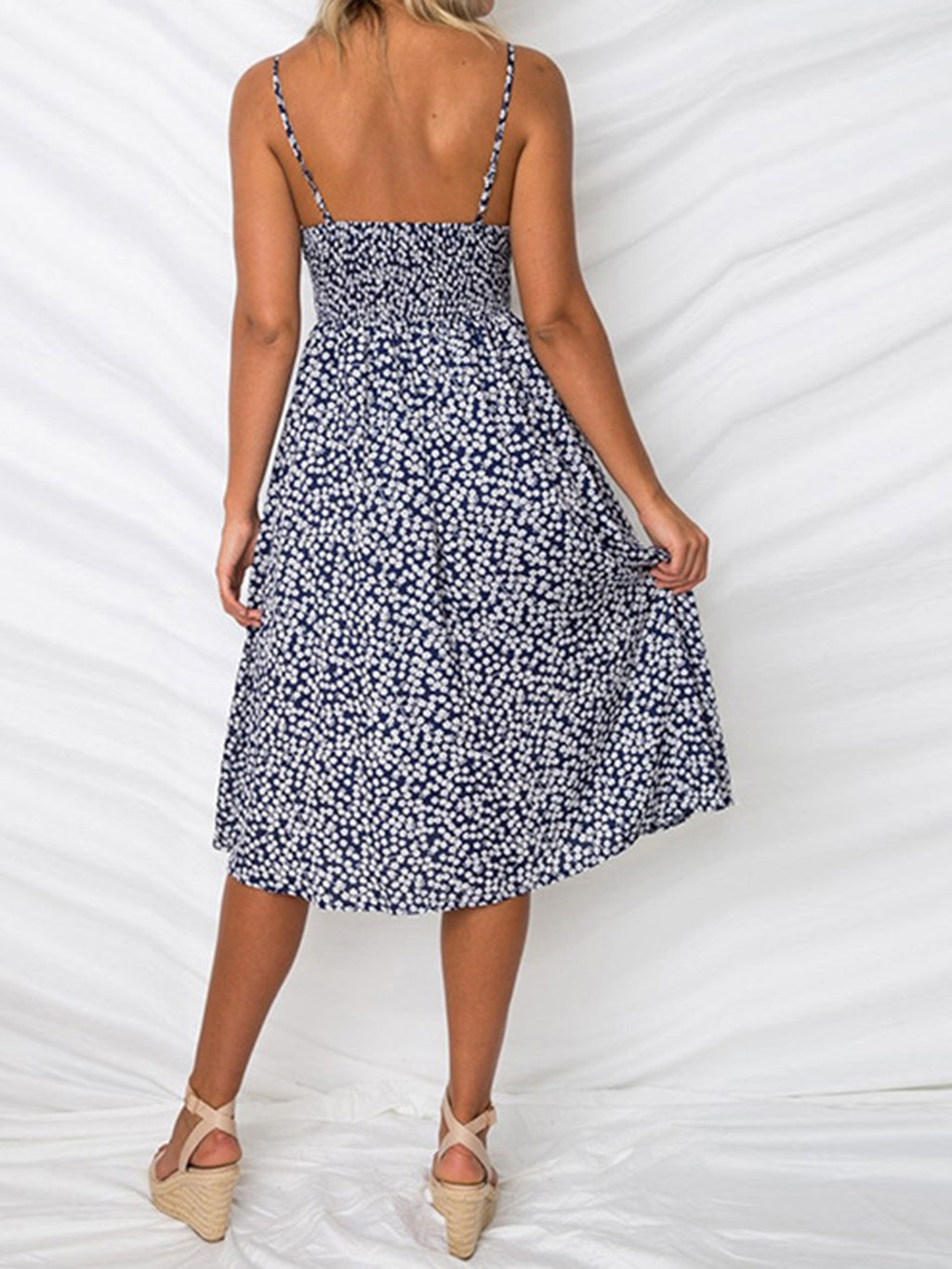 "Chic cutout sweetheart neckline cami dress with decorative button details. Flirty and feminine style, perfect for casual or evening outings."