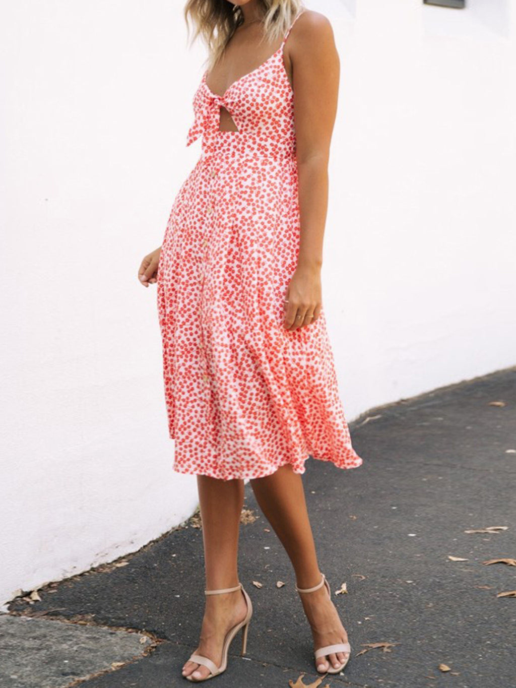"Chic cutout sweetheart neckline cami dress with decorative button details. Flirty and feminine style, perfect for casual or evening outings."