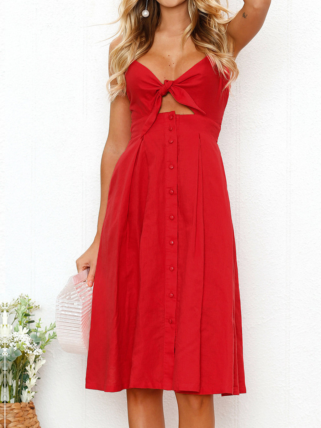 "Chic cutout sweetheart neckline cami dress with decorative button details. Flirty and feminine style, perfect for casual or evening outings."